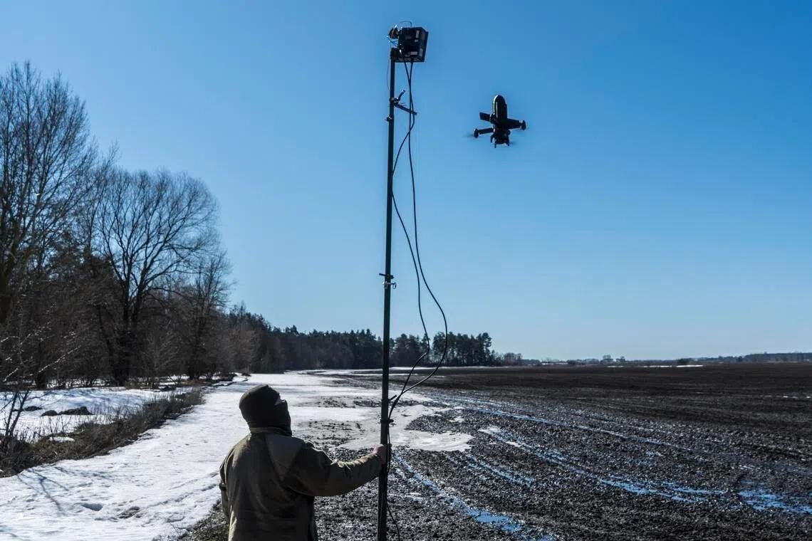 Unmanned aerial vehicle flying over a field