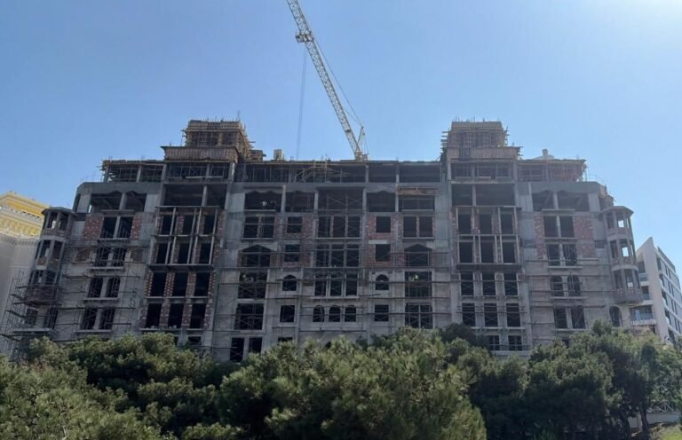 Dense residential buildings under construction in Bayil, Baku