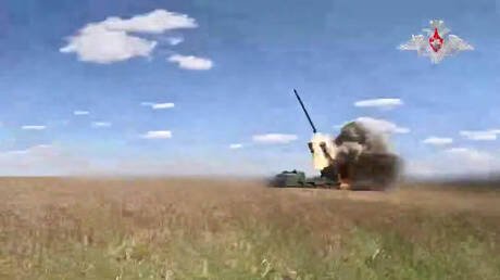 Tornado-S multiple launch rocket system firing during combat operations