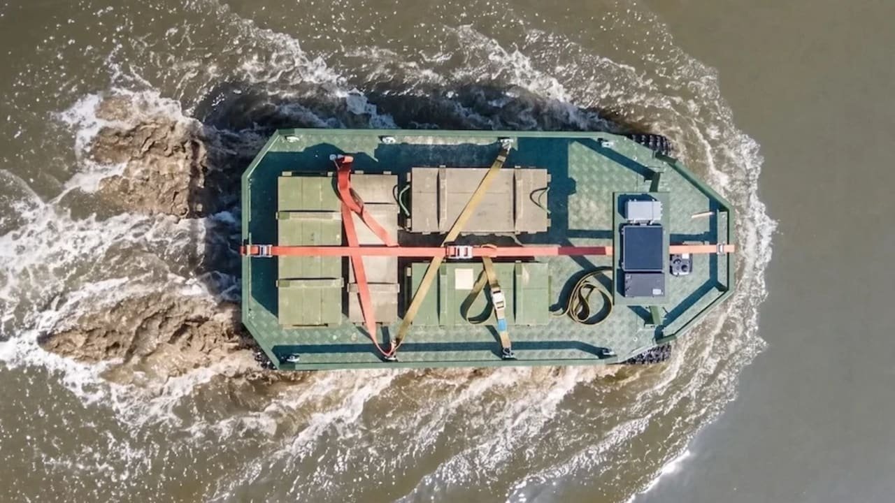 Amphibious unmanned ground vehicle during a logistics mission