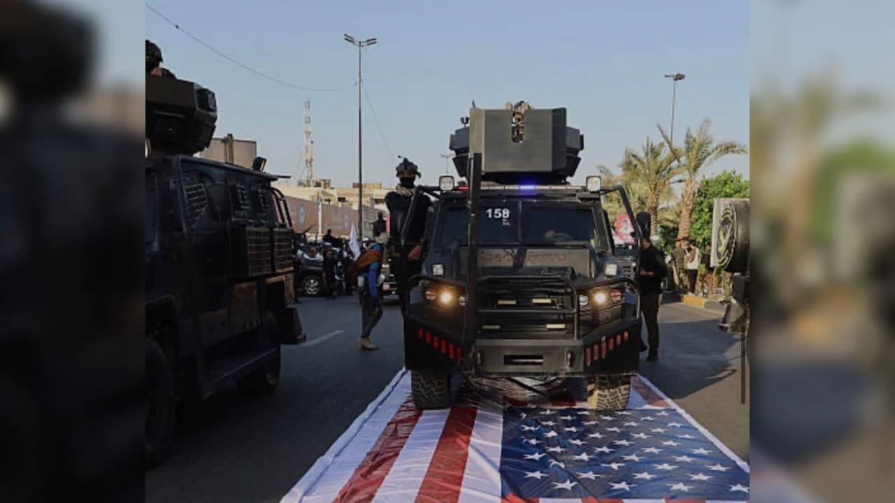 Iraqi militiamen desecrating the US flag