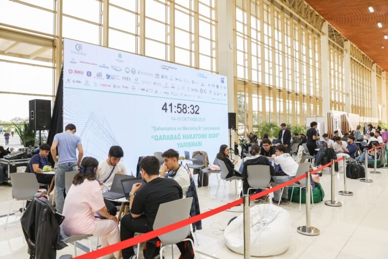 Participants working at the Karabakh Hackathon 2026 during the Rebuild Karabakh exhibition