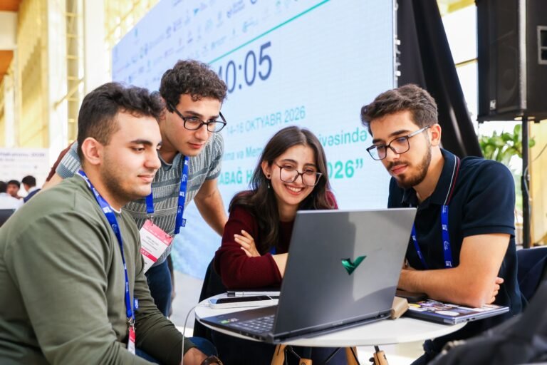 Participants working at the Karabakh Hackathon 2026 during the Rebuild Karabakh exhibition