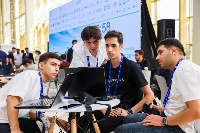 Participants working at the Karabakh Hackathon 2026 during the Rebuild Karabakh exhibition