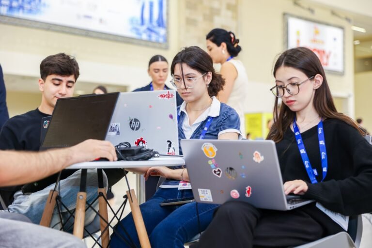 Participants working at the Karabakh Hackathon 2026 during the Rebuild Karabakh exhibition